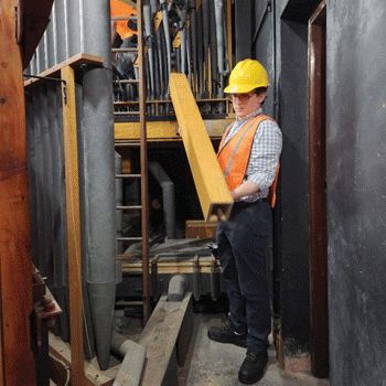 Canon Director of Music Stephen Buzard removing one of the first pipes in City Temple of London