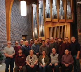 Dobson Pipe Organ Builders, Ltd., employees in front of Dobson Opus 13, Lake City Union Church, Lake City, Iowa