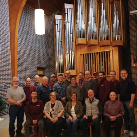 Dobson Pipe Organ Builders, Ltd., employees in front of Dobson Opus 13, Lake City Union Church, Lake City, Iowa